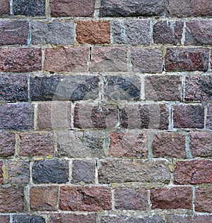 Seamless stone wall from a granite brick