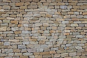 Seamless stone wall made with old bricks.