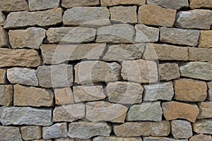 Seamless stone wall made with old bricks.