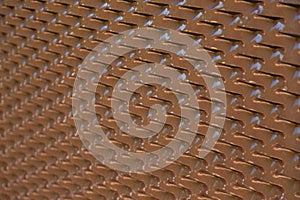 Seamless structured plastic surface in brown with a gradient from sharp foreground on the right to blurry background on the left