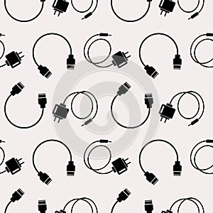 Seamless technology vector pattern, chaotic background with icons of usb cables and batteries, over light backdrop