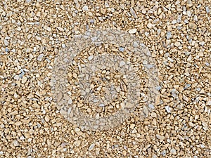 Seamless texture beige gravel. Ground surface road work photo