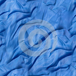 Seamless texture of blue wrinkled satin