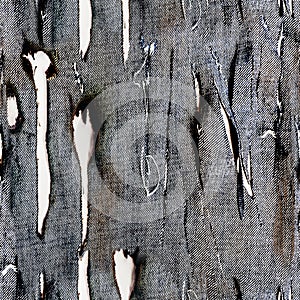 Seamless texture of burned and torn denim