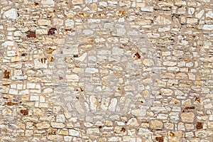 Seamless texture of old stone beige wall