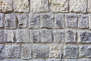 Stone wall from a large cobblestone sandstone close-up