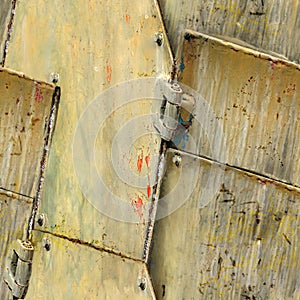 Seamless texture of rusty armor plates surface with hinges