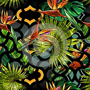 Seamless texture on the theme of the tropics, jungle from palm leaves, monstera, banana leaves, strelitzia and heliconia flowers