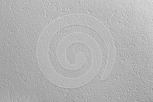 Seamless texture of white polystyrene foam or styrofoam, close-up flat white on white background