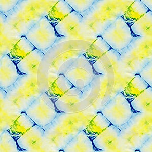 Seamless tie-dye pattern of blue and yellow color on white silk