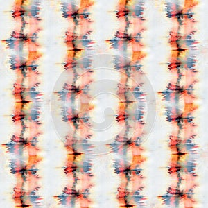 Seamless tie-dye pattern of orange and black color on white silk.