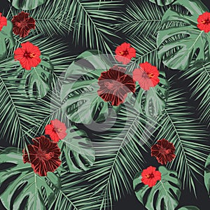 Seamless tropical pattern with hibiscus flowers and exotic palm leaves.