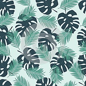 Seamless tropical pattern with leaves monstera and palm on a light green background