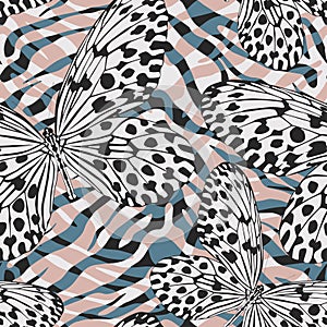 Seamless vector multicolor butterflies pattern. Butterfly on zebra print. Trendy animal motif wallpaper. Fashionable background