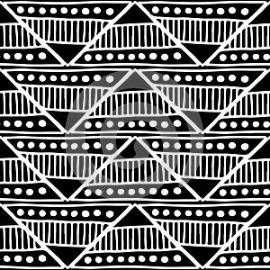 Seamless vector pattern. Black and white geometrical background with hand drawn decorative tribal elements. Print with ethnic, fol