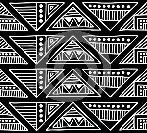 Seamless vector pattern. Black and white geometrical background with hand drawn decorative tribal elements. Print with ethnic, fol