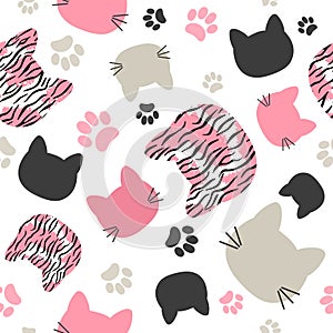 Seamless vector pattern with cats heads and tiger print for kids