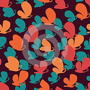 Seamless vector pattern with colorful butterflies silhouettes on dark background