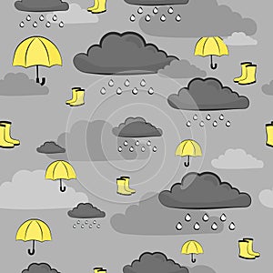 Seamless vector pattern in grey and yellow colous for fabric and wrapping paper with umbrellas and gumboots in clouds