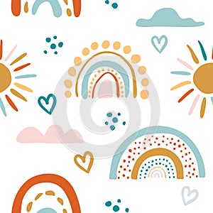 Seamless vector pattern with hand drawn rainbows and sun. Trendy baby texture