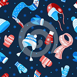 Seamless vector pattern of winter hats, mittens, scarves and snowflakes on a dark blue background