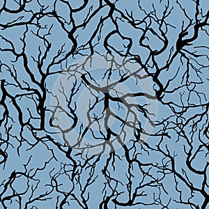 Seamless velvet pattern of black branches on a blue background. Textile ornament from endless silhouettes for fabric, wallpaper