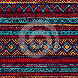 Seamless vintage pattern. Grungy texture. Ethnic and tribal motifs. Blue, orange, red and purple colors.