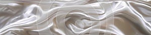 A seamless wide view of delicate white satin fabric, presenting a soft and smooth texture with natural folds.