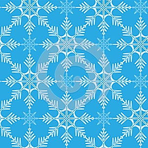 Seamless winter pattern of snowflakes on a blue background