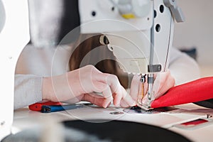 Seamstress hands doing precise work.