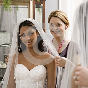 Seamstress helping bride.