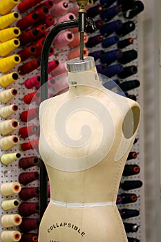 Seamstress mannequin with the workshop in the back