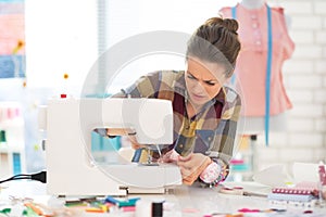 Seamstress sewing in studio