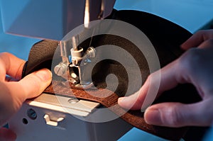 Seamstress Sewing On Velcro Hook-And-Loop Fastener photo