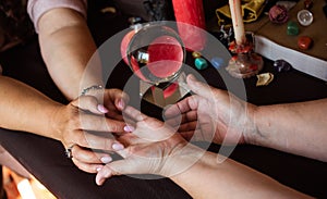 Seance of fortune telling on a hand, medium