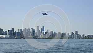 Seaplane flying over the City of Vancouver.