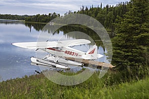 Seaplane Tied Up To Pier