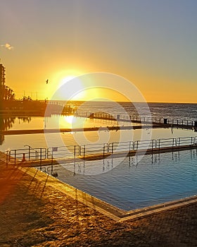 Seapoint public pool with a stunning sunset Cape Town South Africa