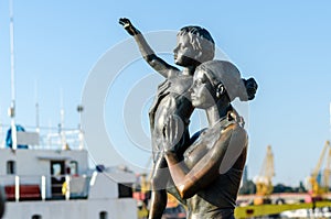 Seaport in Odessa. Monument to the sailor`s wife. Ukraine. May, 2016. Spring background. photo