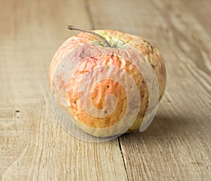 Sear apple on wood background