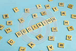 Search for decision concept. The word Decision composed of heaps of different letters on a blue background