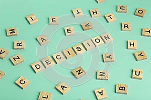 Search for decision concept. The word Decision composed of heaps of different letters on a green background