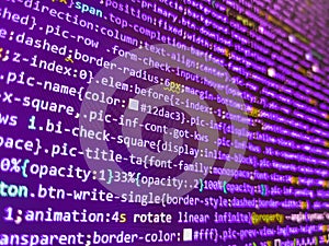 Search engine optimization for better rankings with anchor tags. Programming on monitor background. Digital binary data on