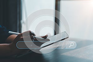 Search Engine Optimization SEO, data searching technology. business hands typing on digital tablet keyboard to search the