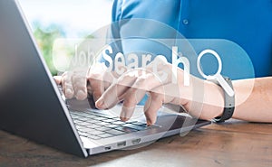 Search Engine Optimization SEO, data searching technology. Man hands typing on laptop computer keyboard to search information via