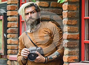 Search for inspiration. hipster man with beard use professional camera. photographer retro camera. journalist is my