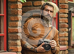 search for inspiration. hipster man with beard use professional camera. photographer retro camera. journalist is my