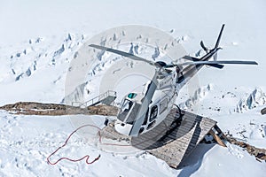 Search and rescue helicopter above glacial crevasses, Aletsch Glacier, Switzerland