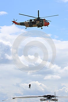 Search and Rescue helicopter hoists two men up