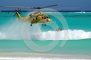 Search and rescue operation in sea. Emergency rescue helicopter flies over sea surface, looking for victims after crash